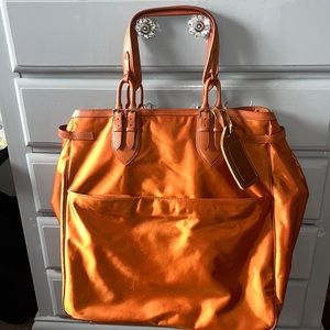 TUMI overnight bag, color orange, regular wear